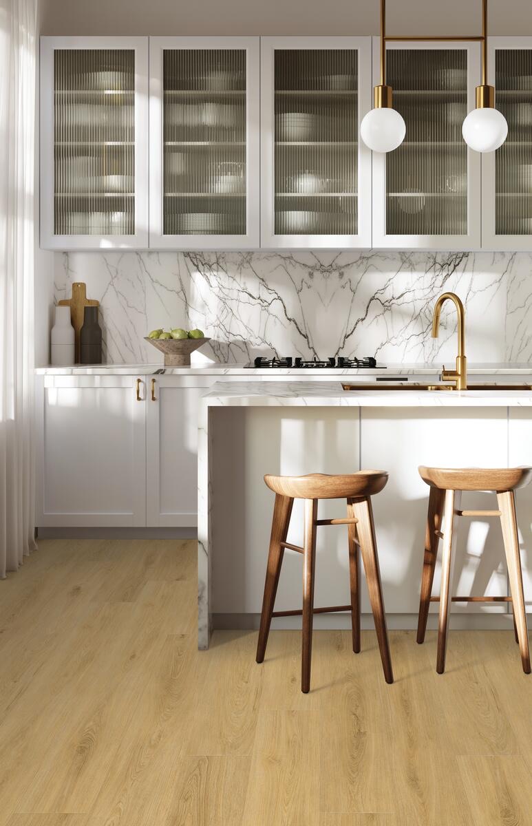 Kitchen island with a brass faucet and pendant lights